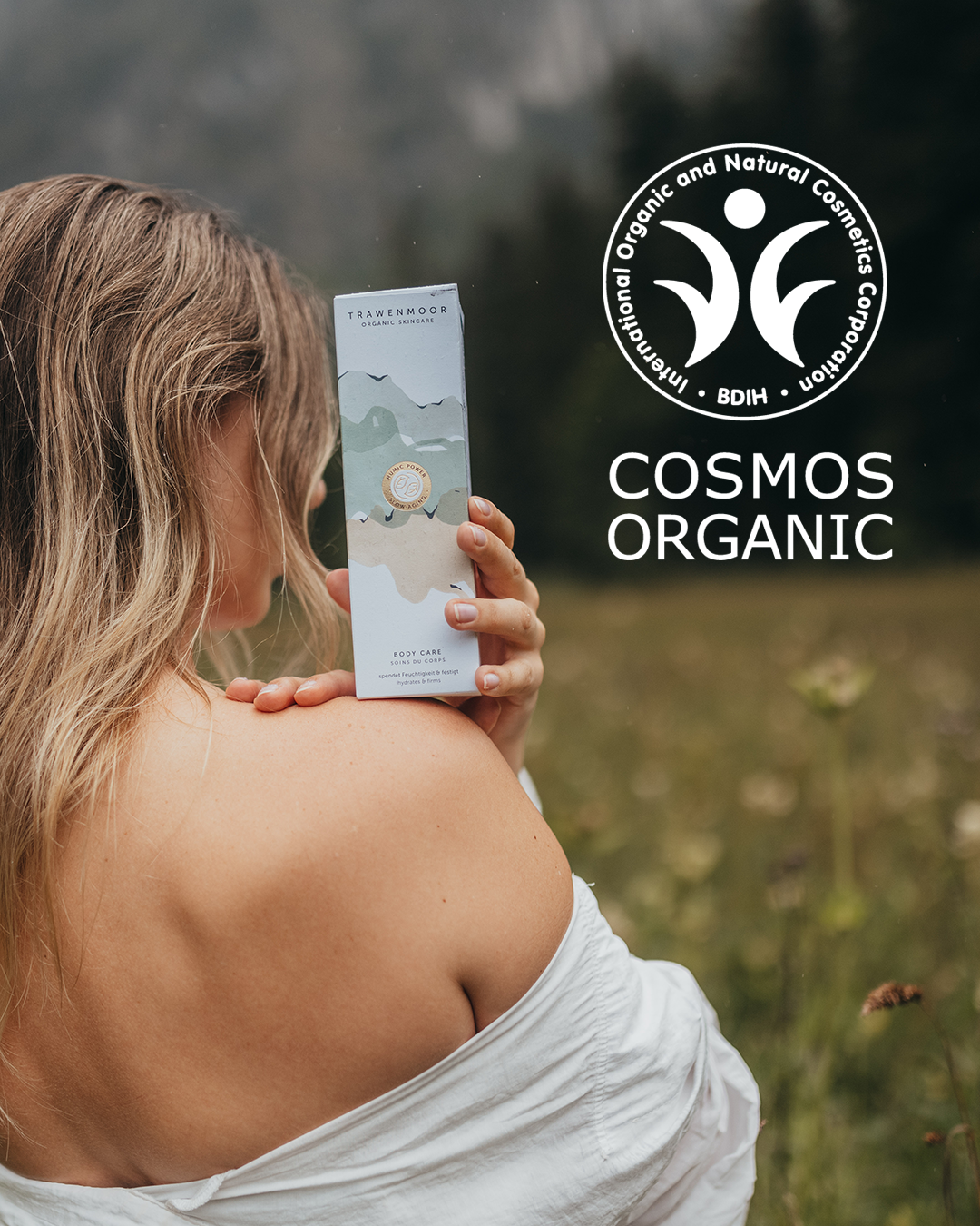 Woman holding product, Cosmos Organic label